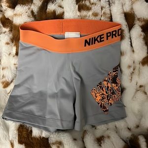 Orange and gray Nike pros